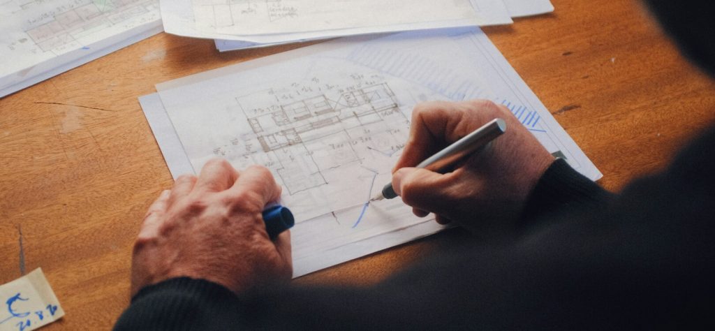 Designer sketching home renovation plans for HDB flat