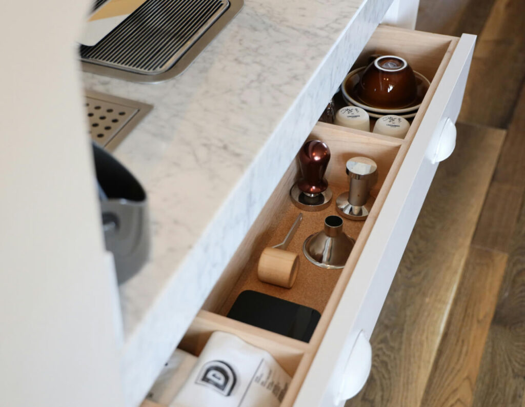 Wooden kitchen drawer with soft-closing feature